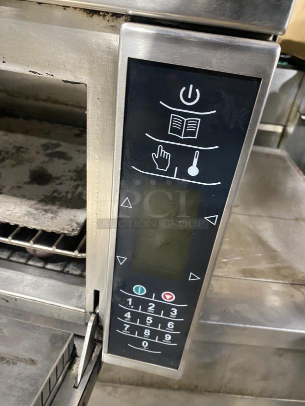 Amana AXP22 commercial stainless steel countertop microwave oven, features keypad controls, used condition, 208-230V.