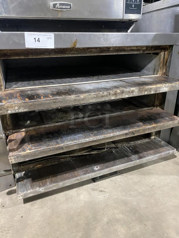 Amana GP-61 commercial stainless steel countertop oven with two baking chambers, visible wear, model label on top.