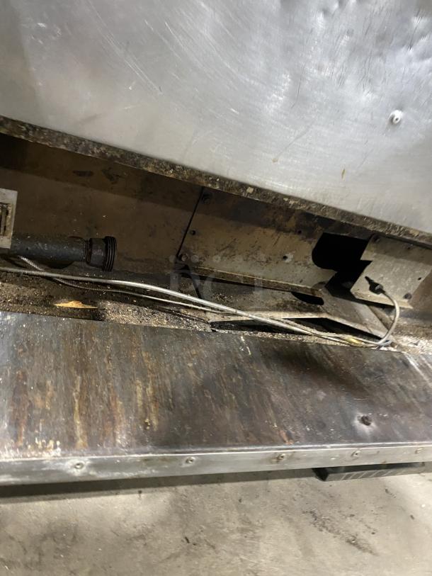 Amana GP-61 commercial stainless steel countertop oven, two baking chambers, visible wear. Model tag: GP-61.