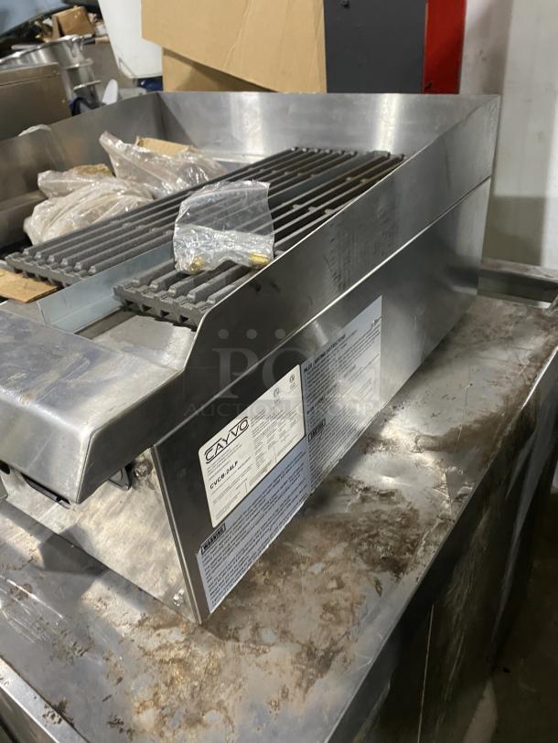 Cayvo CVCB-24LP commercial stainless steel gas char-rock broiler. Features durable construction, model and warning labels.