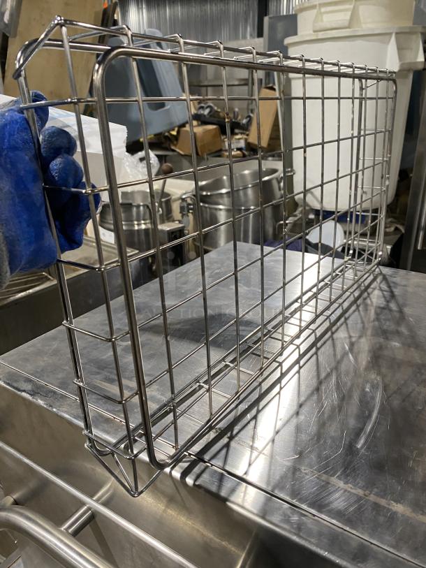 Stainless steel commercial bagel wrap holder, sturdy wire construction, excellent condition, ideal for foodservice use.
