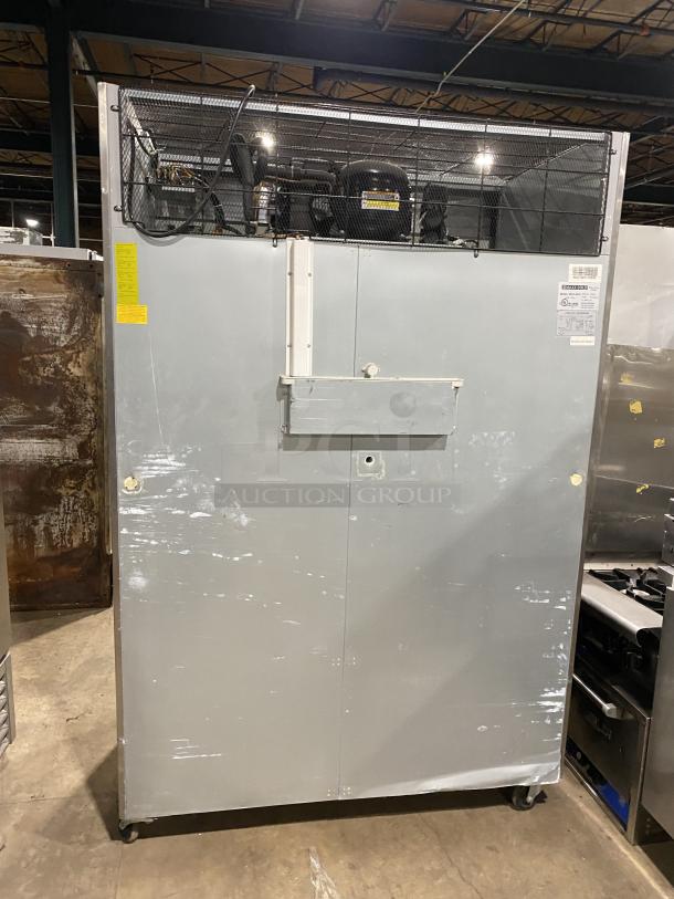 Maxx Cold MXCF-49FD stainless steel freezer, dual solid doors, six shelves, on casters, showing model and serial number tags.