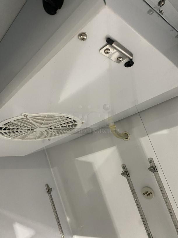 Maxx Cold MXCF-49FD commercial stainless steel reach-in freezer interior, 2 solid doors, 6 shelves, on casters.