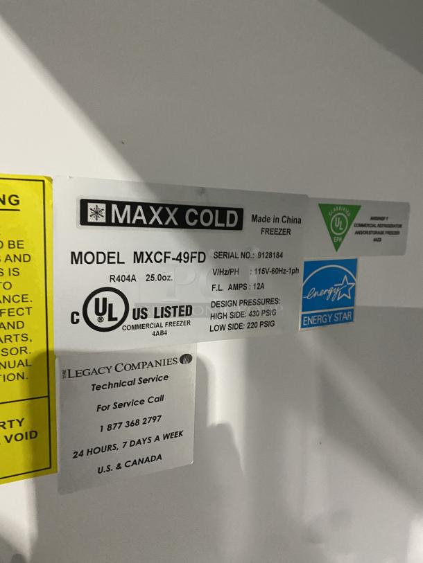 Maxx Cold MXCF-49FD commercial freezer label showing model, serial number 9128184, UL certification, and energy rating.