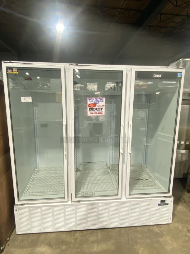 Master Bilt BMD-74 commercial refrigerator display with 3 glass doors and 12 shelves. Serial No. 166269 NCC01, 115V 1PH.
