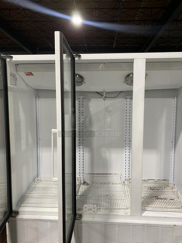 Master Bilt BMD-74 commercial refrigerator display with 12 shelves and 3 glass doors, model BMD-74, 115V, in used condition.