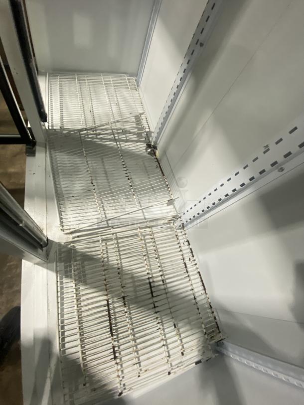 Master Bilt BMD-74 commercial refrigerator, white, 12 shelves, 3 glass doors shown inside, 115V, model SN: 166269 NCC01.