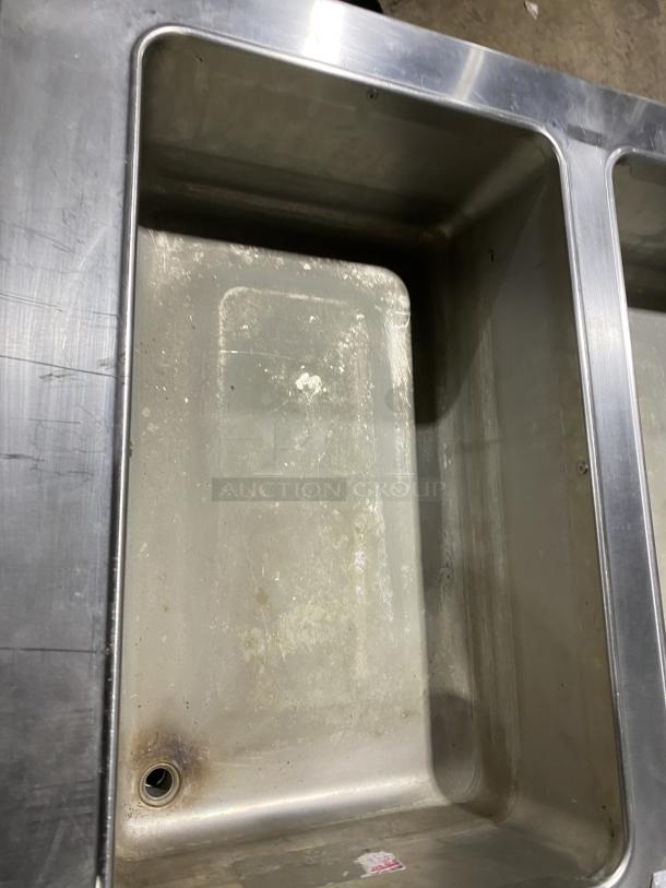 Duke E305-25SS-SWM stainless steel hot food table with 5 openings, undershelf, on legs, in used condition.