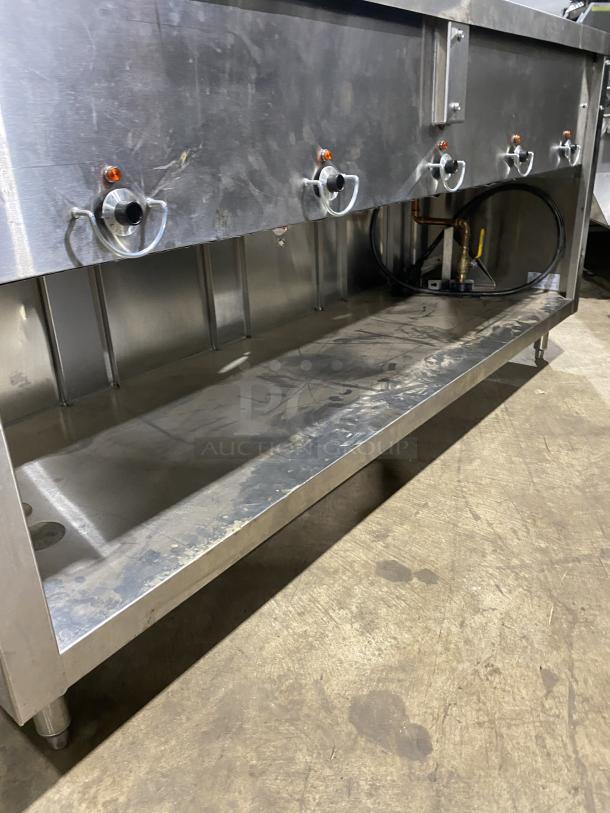 Duke E305-25SS-SWM stainless steel electric hot food table with five top openings, undershelf, 208V, on legs.