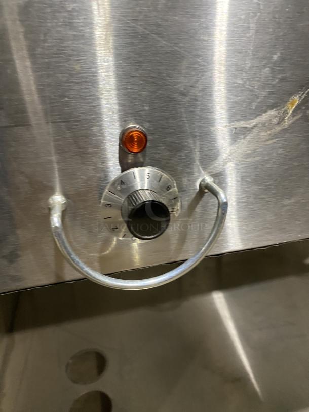 Duke commercial stainless steel undershelf electric hot food table, model E305-25SS-SWM, with temperature dial and indicator.