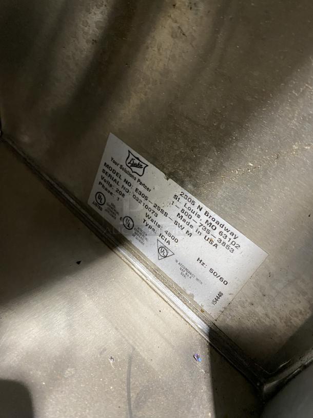 Duke commercial stainless steel electric hot food table, model E305-25SS-SWM, with 5 openings, undershelf, on legs.