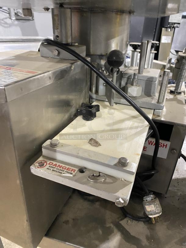 Patty O Matic 330A stainless steel meat forming machine, automatic, high volume, 115V, on casters, with safety warning label.
