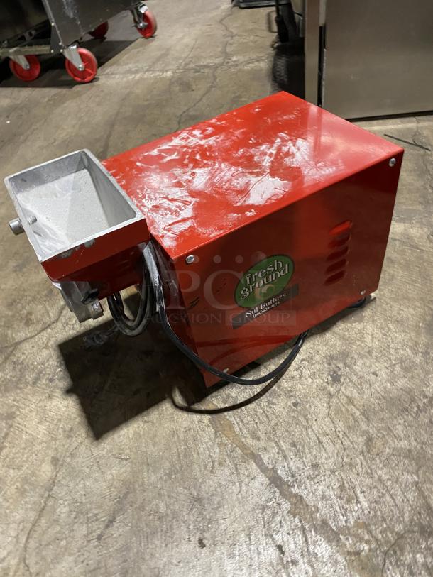 Olde Tyme Peanut Butter Grinder Model PN2, red, 115V, 1 Phase. Features fresh ground label, visible wear, serial A16070912.