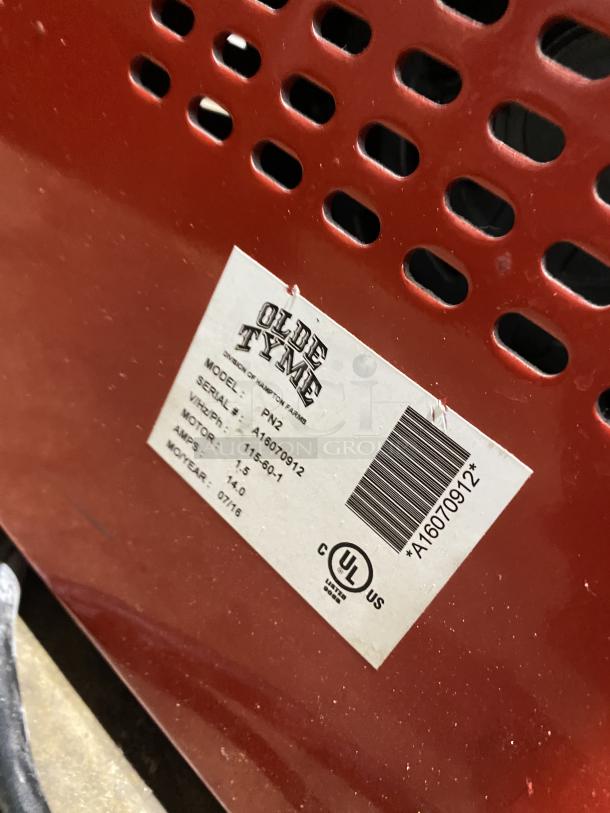 Olde Tyme PN2 peanut butter grinder, model PN2, serial A16070912, red with label showing specs, in used condition.