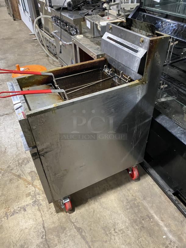 Migali C-F40-NG stainless steel deep fat fryer, natural gas, with backsplash, basket hanger, and casters.