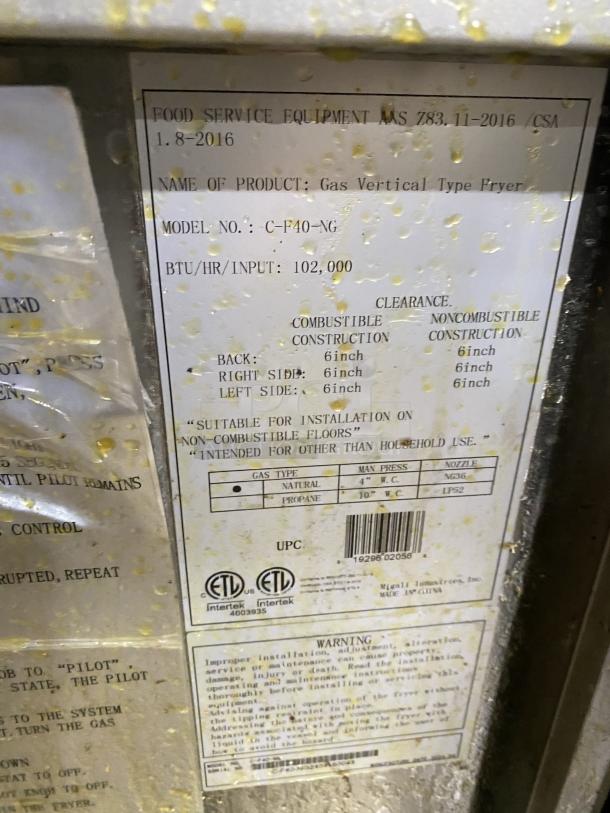 Migali C-F40-NG commercial stainless steel deep fat fryer with natural gas, backsplash, basket hanger, casters, and frying baskets.