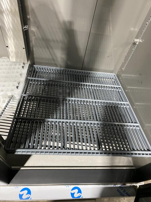 Kutano stainless steel reach-in freezer, model KUTF 2 SS, features two doors. Item appears in good condition.
