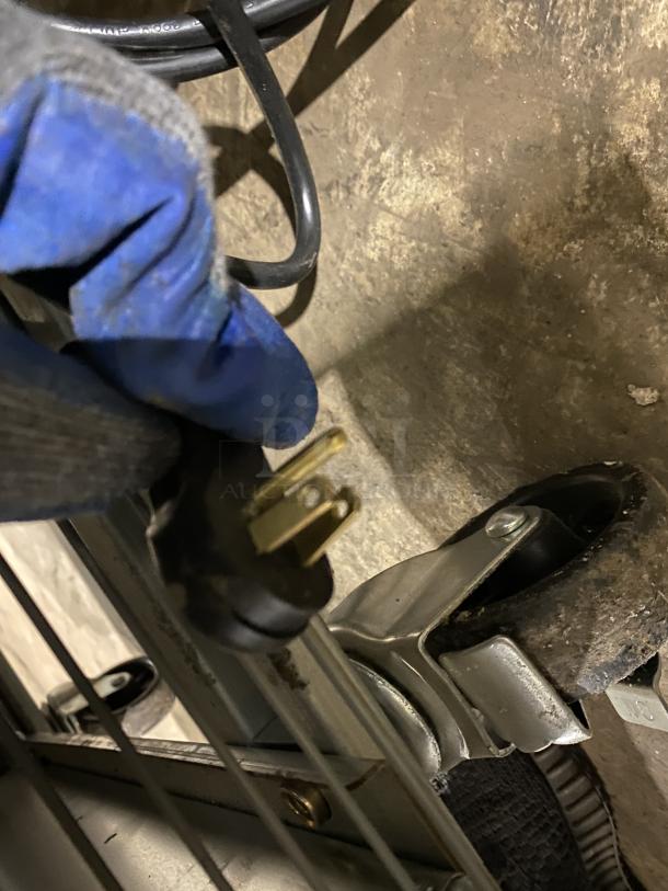 Kutano Commercial Stainless Steel Freezer power cord and wheel. Model: KUTF 2 SS, SN: 8103206950. 115V, 1 Phase.