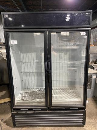 True commercial freezer, model GDM-49F-HC-TSL01. Black stainless steel body, 2 glass doors, used. Serial: 9159869.