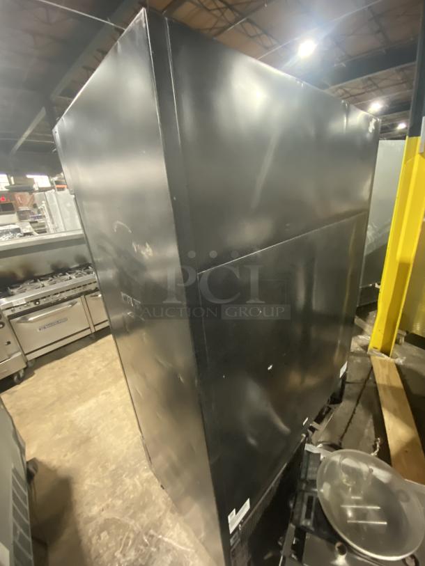 True commercial freezer, model GDM-49F-HC-TSL01, black stainless steel, 2 glass doors, visible markings, used condition.