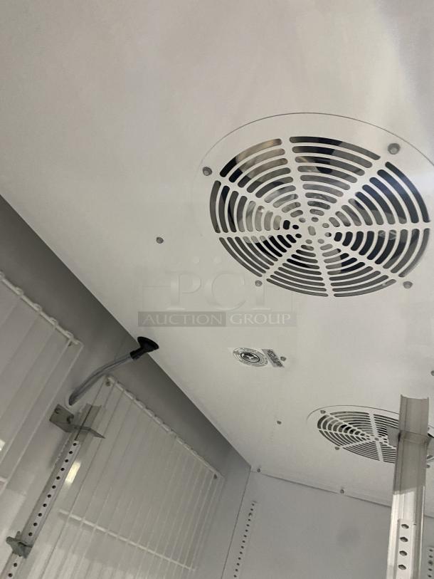 Interior of True commercial freezer model GDM-49F-HC-TSL01, showing ventilation system and shelving brackets.