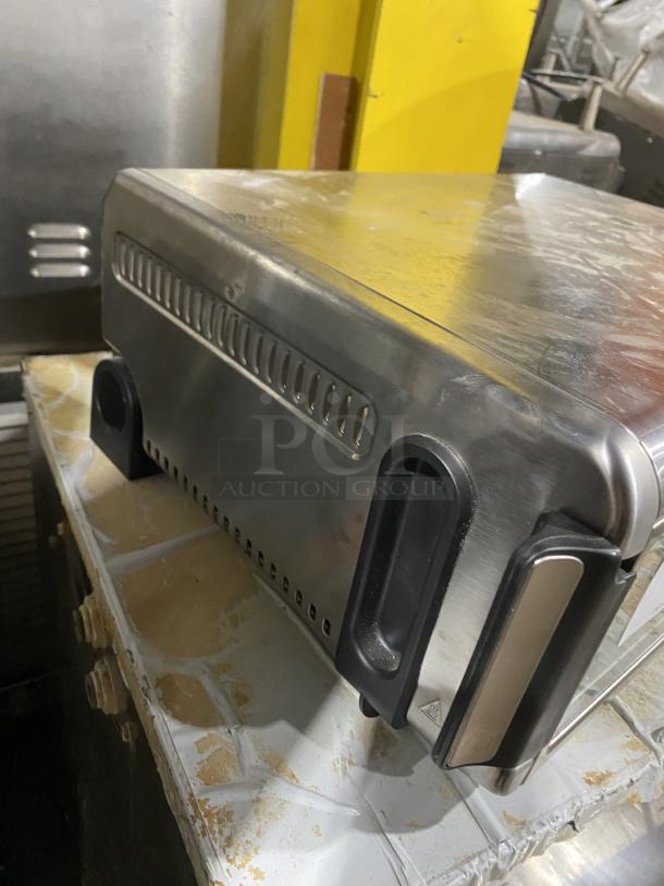 Ninja Countertop Digital Air Fry Oven Model FT102CO with view-through door, 120V, shown in used condition.