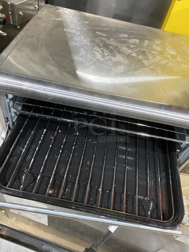 Ninja FT102CO digital air fry oven with view door, showing interior and rack. Used condition, 120V. SN: U17RQ603F1A6.