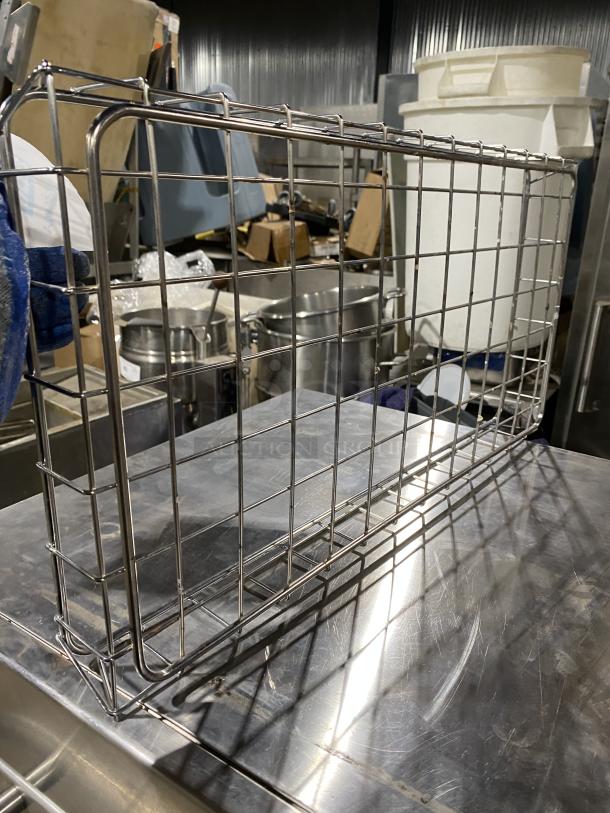 Chrome-plated full-size wired rack for bagels and pastries, excellent condition, with sturdy grid design for commercial use.