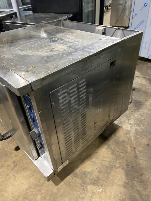 Alto-Shaam commercial stainless steel natural gas oven on casters, model 710358-002, wired rack, 110-115V, used condition.