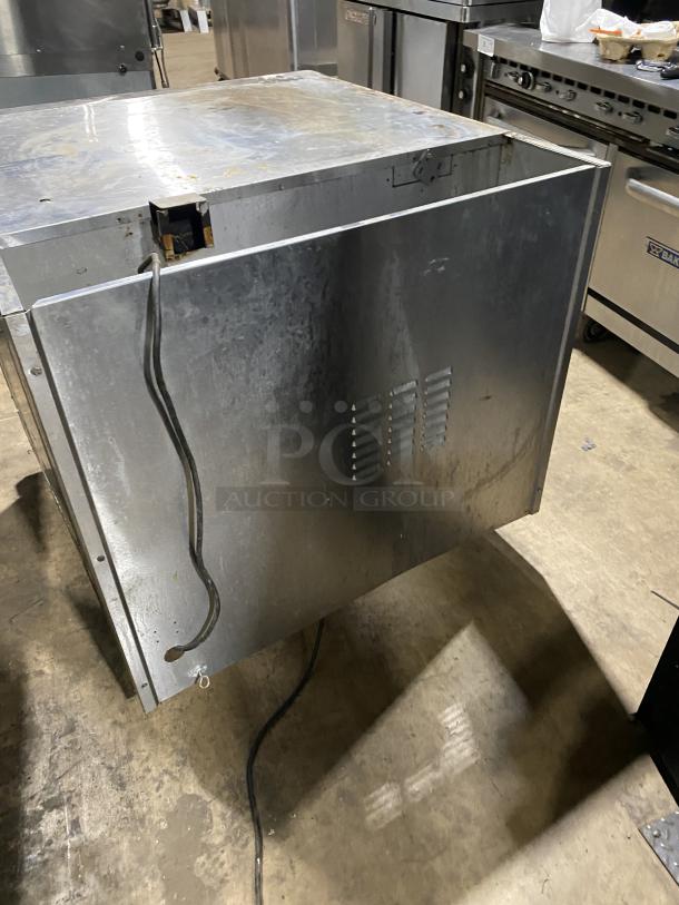 Alto-Shaam commercial stainless steel natural gas oven on casters, with wired rack. SN: 710358-002. Visible signs of wear.