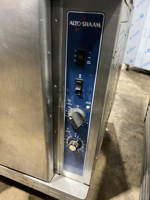 Alto-Shaam stainless steel commercial oven, natural gas powered, with wired oven rack, on casters. Serial: 710358-002.