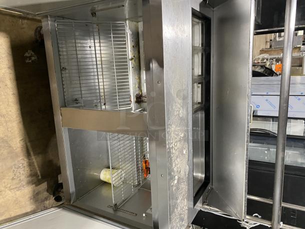 Hoshizaki CRMR48-12 commercial refrigerator with top rail, stainless steel. Visible wear, interior shelving shown. SN: B50037E.