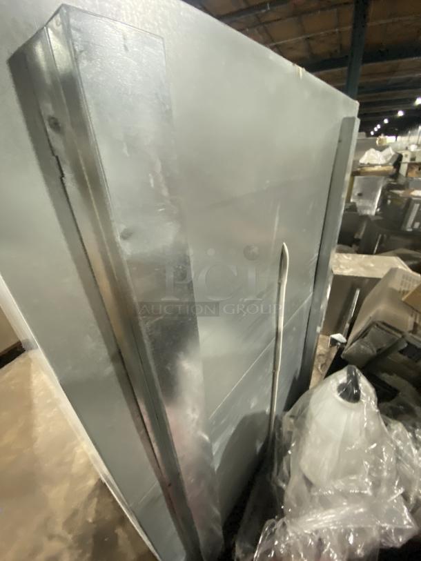 Master-Bilt BMG-48 commercial refrigerator, white double glass swing doors, poly-coated wire rack, 115V, visible wear.