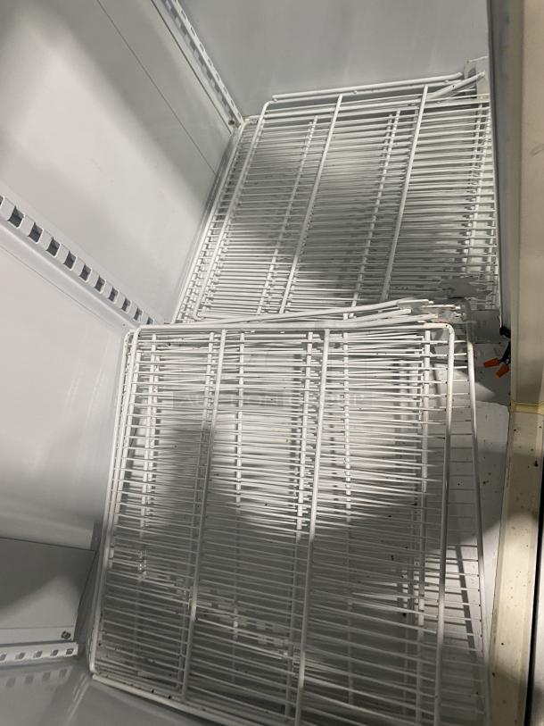 Master-Bilt commercial refrigerator BMG-48 with poly-coated wire rack, white double glass swing doors, 115V 1 phase, SN: HW506620.