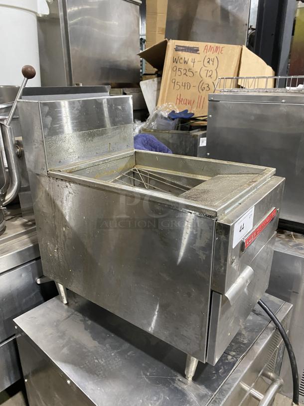American Range commercial stainless steel gas fryer on legs, in used condition, with visible branding label.