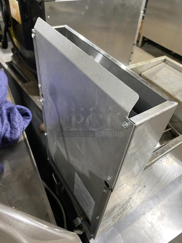 American Range stainless steel commercial gas fryer, on legs, in good condition. Side panel visible, displaying some wear.