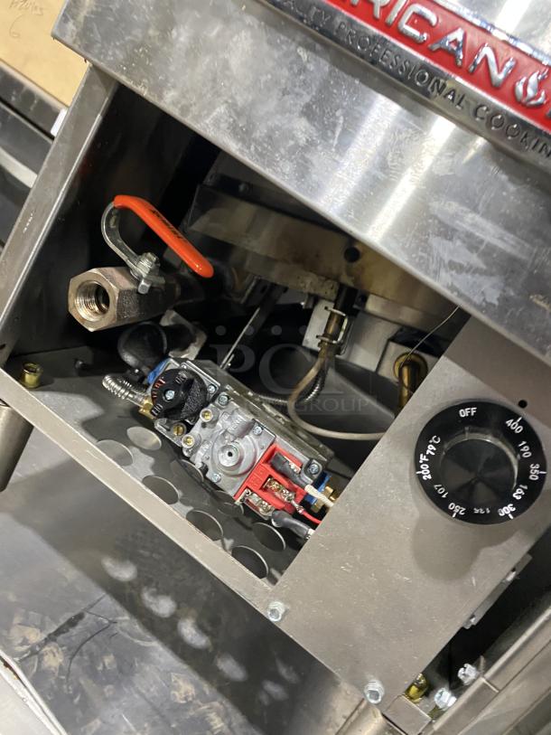 American Range commercial stainless steel gas fryer, featuring temperature control dial, sturdy legs. Good condition.