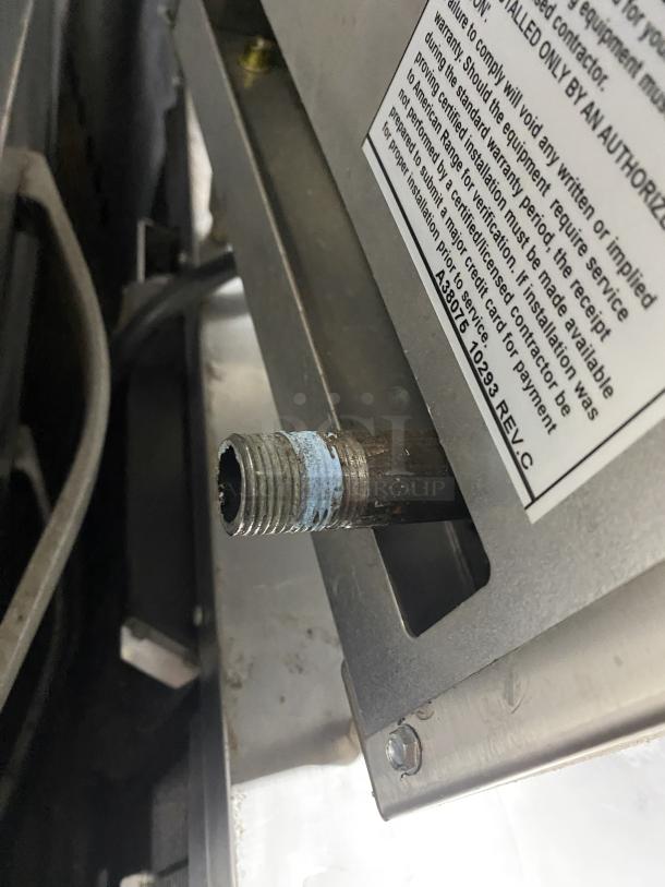 American Range commercial stainless steel gas fryer connector and label, showing installation instructions. In good condition.