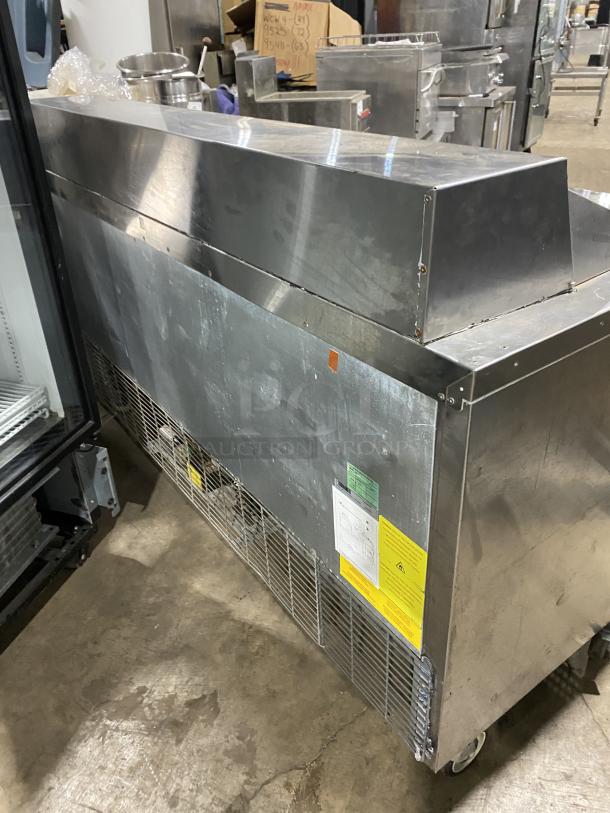 Asber APTS7218 3-Door Stainless Steel Sandwich/Salad Prep Table Refrigerator, poly-coated rack, on casters.