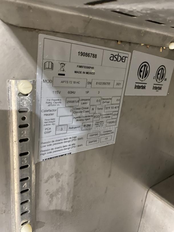 Asber APTS7218 3-door commercial stainless steel prep table with poly-coated wired rack, model details and specs shown.