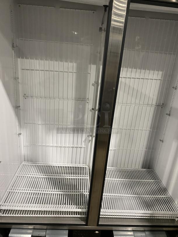 True commercial double glass door freezer, model GDM-49F-HCX-TSLO1. Features poly-coated wire racks.