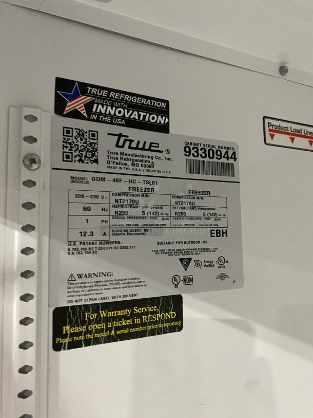 True Commercial Black Double Glass Swing Door Freezer, model GDM-49F-HCX-TSLO1, SN: 9330944, with poly coated wire rack.