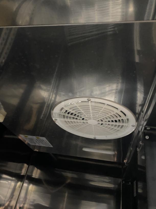 Maxx Cold 2 Door Reach-In Refrigerator, Model MCR-49FDHC-V, stainless steel interior with fan, on casters.