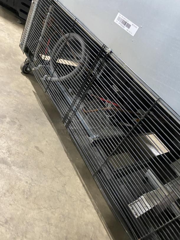 Maxx Cold MCR-49FDHC-V commercial refrigerator underside, showing poly-coated racks and casters. Solid stainless steel construction.