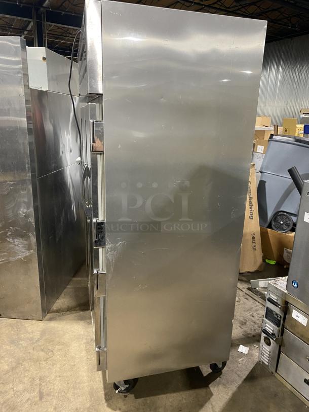 True Commercial Series STG2R-2G stainless steel refrigerator, 2-section glass door, 115V, very good condition.