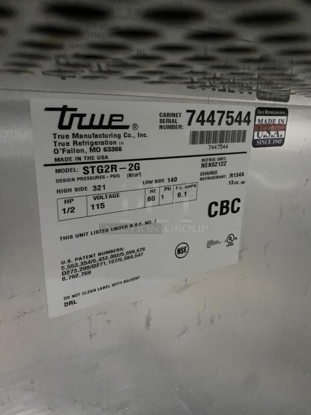 True Commercial Series stainless steel refrigerator, model STG2R-2G. Features two glass doors. Serial number 7447544.