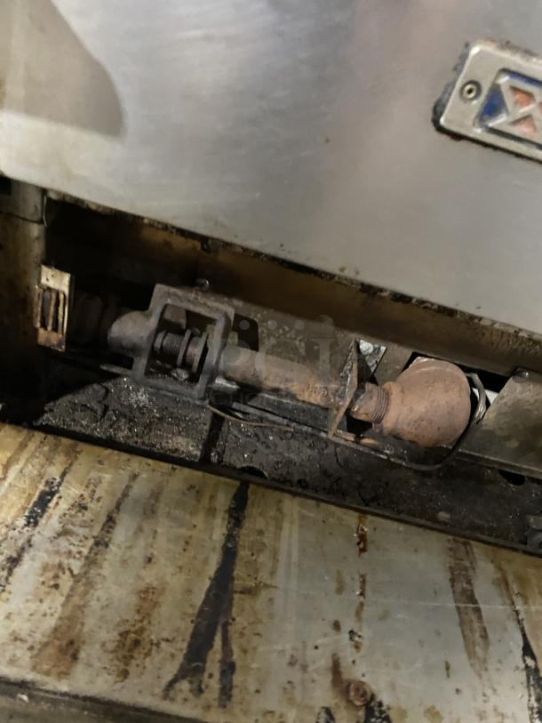 Bakers Pride GP-51 commercial stainless steel countertop deck oven, natural gas powered, showing burner details.