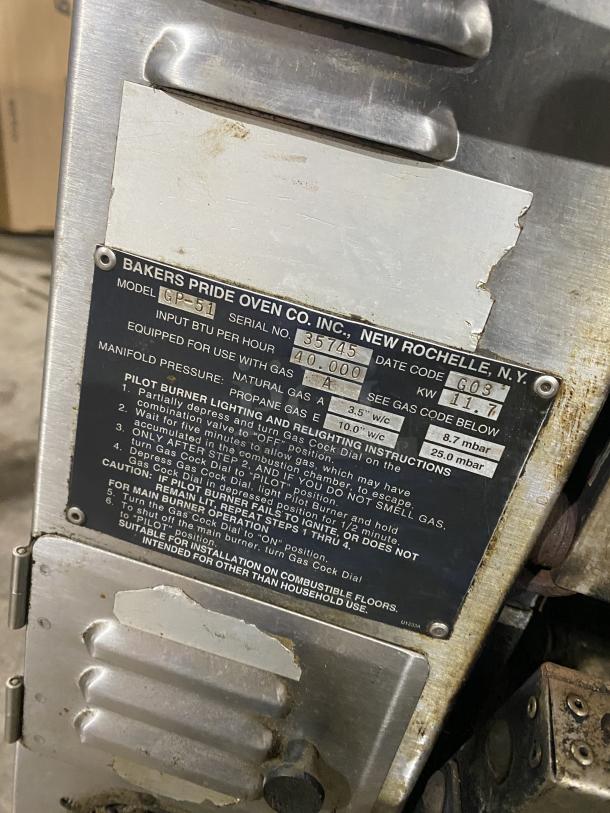 Bakers Pride GP-51 commercial stainless steel countertop deck oven, natural gas powered, serial no. 35745, with instruction panel.