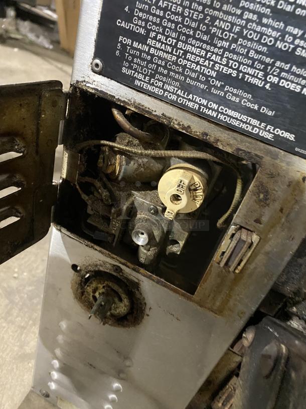 Bakers Pride GP-51 stainless steel deck oven, natural gas, visible wear, machine components, SN: 35745, caution label.