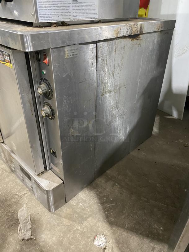 Blodgett commercial stainless steel electric convection oven, single stack, with thermostatic control and wired oven rack. Signs of wear.